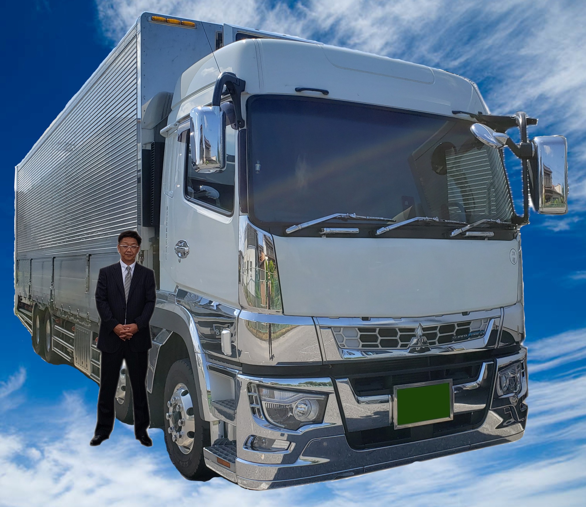 画像：空とトラックと社長